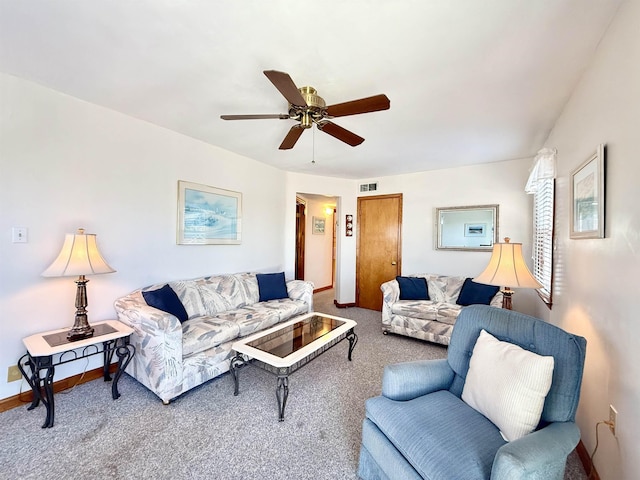 carpeted living room featuring ceiling fan