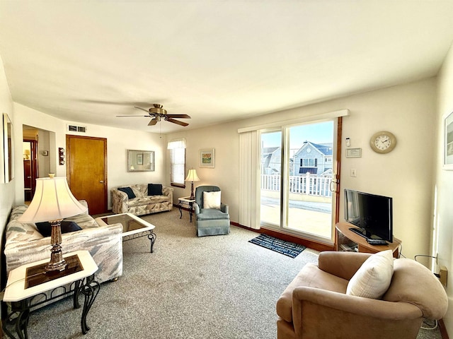 living room with carpet floors and ceiling fan