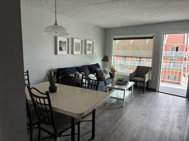 9101 Atlantic Ave Unit 303, Wildwood Crest, NJ 08260 - dining area featuring a textured ceiling and wood finished floors