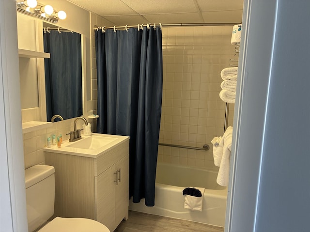 9101 Atlantic Ave Unit 303, Wildwood Crest, NJ 08260 - full bathroom featuring vanity, shower / bath combo, wood finished floors, and a drop ceiling
