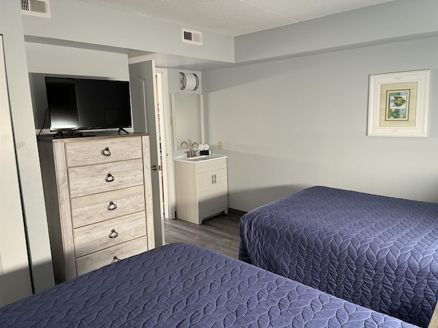9101 Atlantic Ave Unit 303, Wildwood Crest, NJ 08260 - bedroom featuring wood finished floors and a sink
