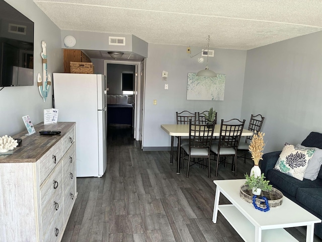 9101 Atlantic Ave Unit 303, Wildwood Crest, NJ 08260 - living room with dark wood-style floors and a textured ceiling