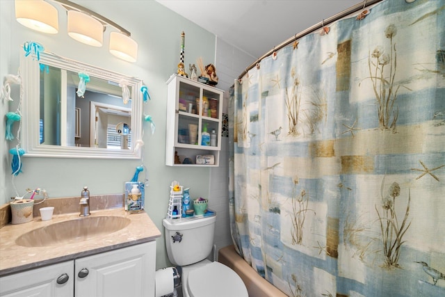 full bathroom with shower / bathtub combination with curtain, vanity, and toilet