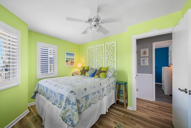 bedroom with ceiling fan and dark wood-type flooring