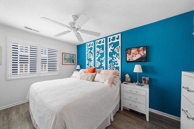 bedroom featuring ceiling fan and dark hardwood / wood-style floors