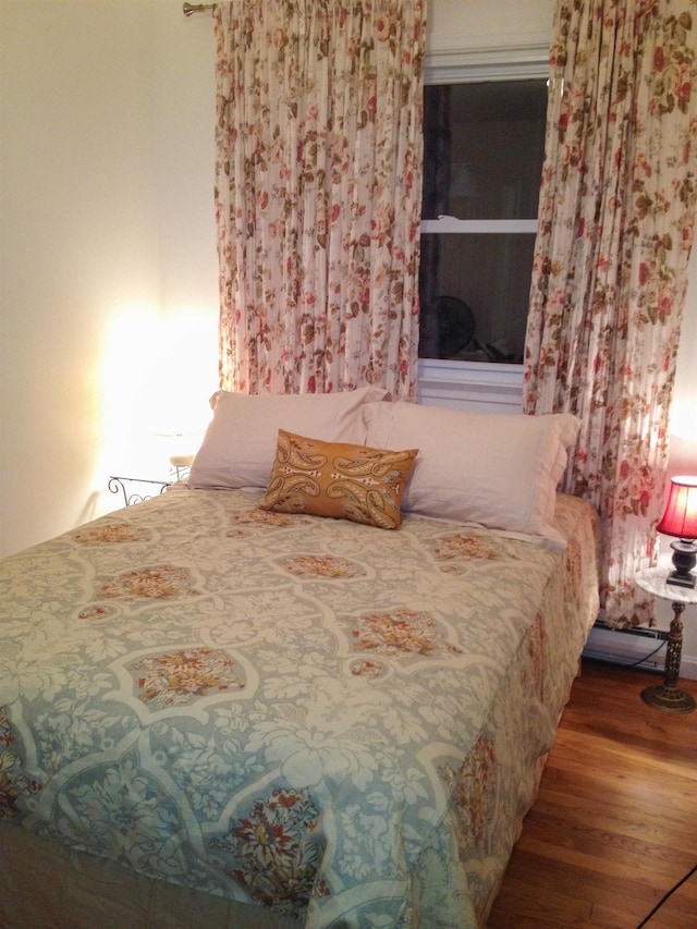 bedroom featuring hardwood / wood-style floors