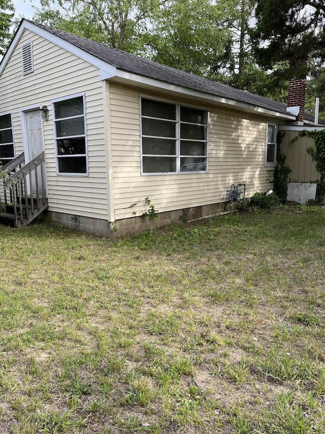 149 E Florida Ave, Villas, NJ 08251 - view of side of property featuring entry steps, a lawn, crawl space, and a shingled roof
