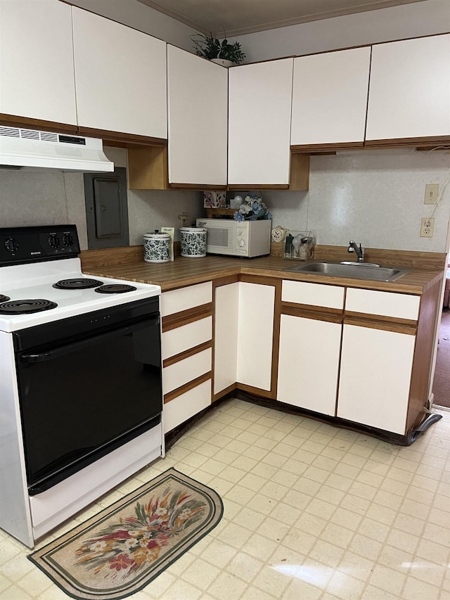 149 E Florida Ave, Villas, NJ 08251 - kitchen featuring range with electric stovetop, under cabinet range hood, white microwave, a sink, and white cabinetry