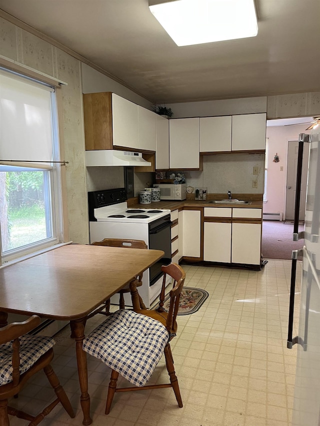 149 E Florida Ave, Villas, NJ 08251 - kitchen with electric range, a sink, white cabinetry, light floors, and under cabinet range hood
