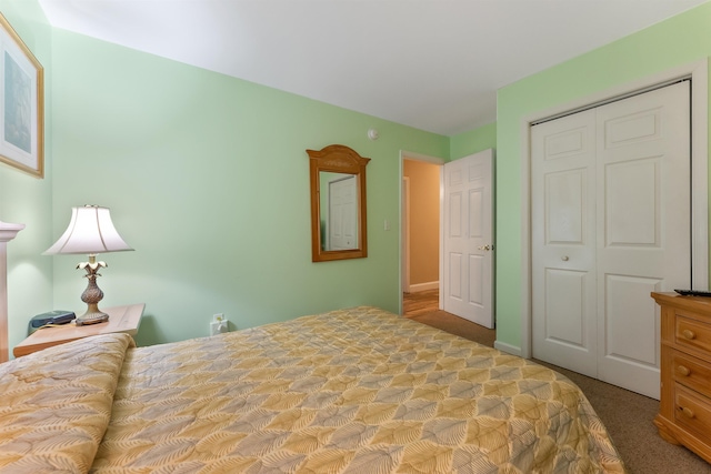 bedroom with light carpet and a closet