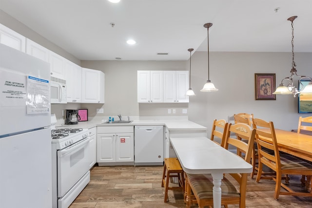 kitchen with sink, white appliances, and white cabinets