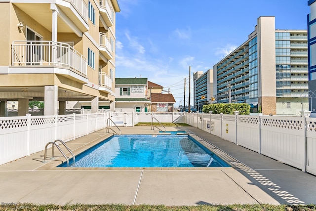 view of swimming pool featuring a patio