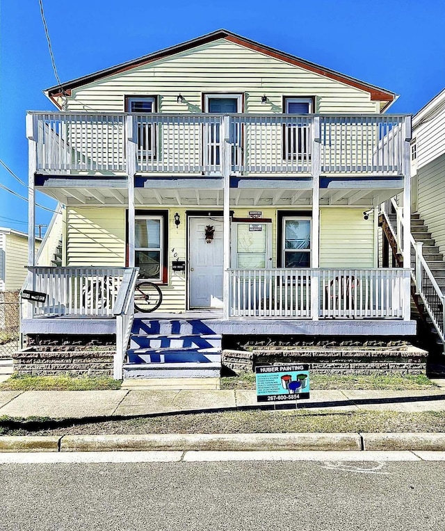 view of front of home featuring a balcony and a porch