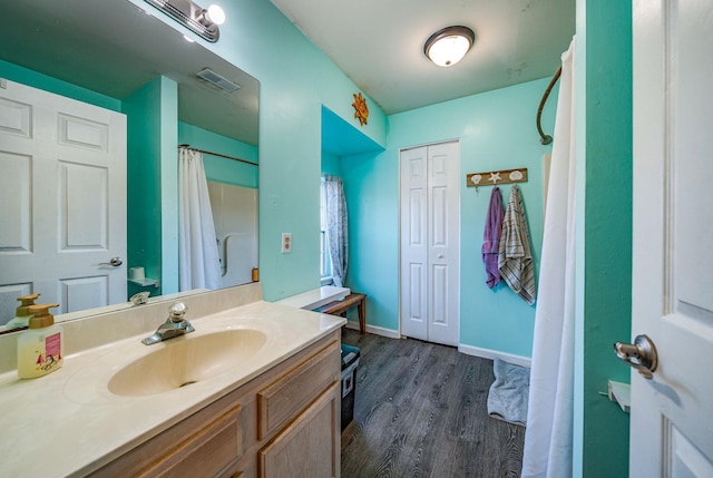 bathroom featuring hardwood / wood-style floors and vanity