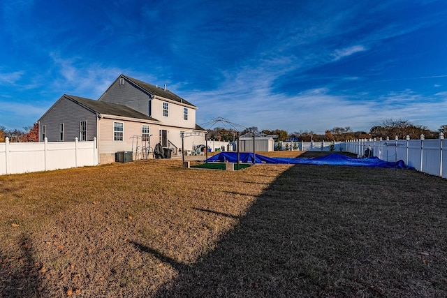 view of yard with a shed and cooling unit