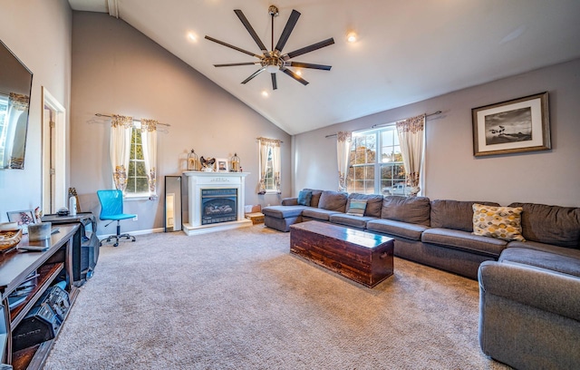 living room featuring ceiling fan, carpet, and high vaulted ceiling