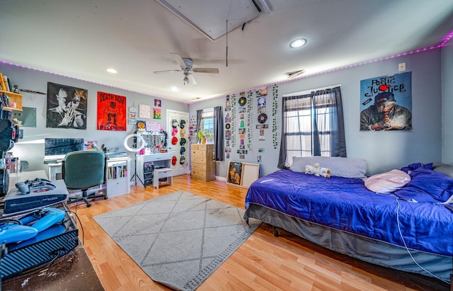 bedroom with wood-type flooring and ceiling fan