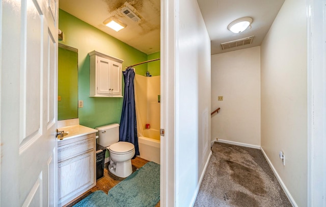 full bathroom featuring vanity, toilet, and shower / tub combo