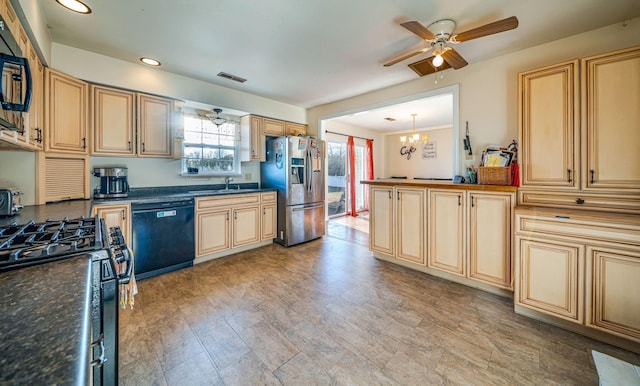 kitchen with ceiling fan with notable chandelier, sink, decorative light fixtures, and black appliances