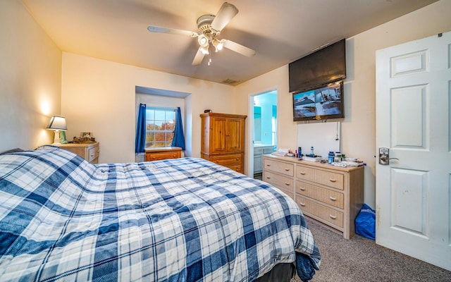 bedroom with connected bathroom, carpet floors, and ceiling fan