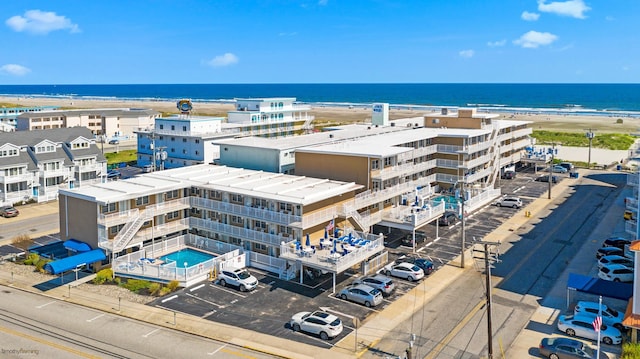 aerial view featuring a water view and a view of the beach