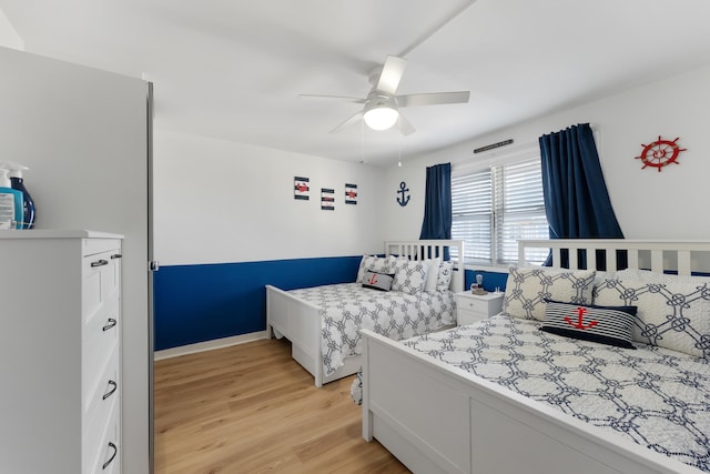 bedroom featuring ceiling fan and light wood-type flooring