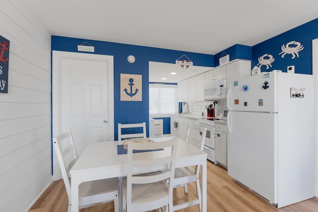 dining room featuring light hardwood / wood-style flooring and sink