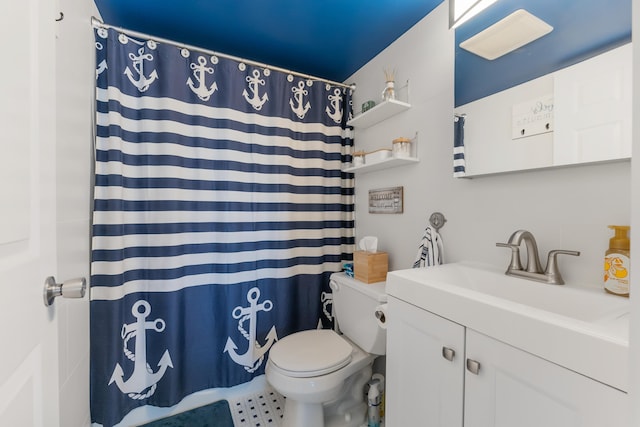 bathroom with vanity, toilet, and walk in shower