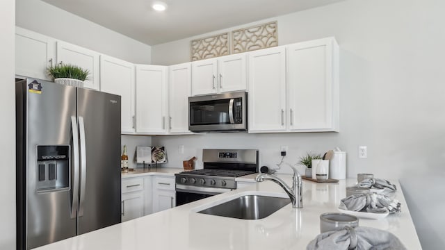 212 Bentz Ave, Villas, NJ 08251 - kitchen featuring appliances with stainless steel finishes, a sink, light countertops, and white cabinets