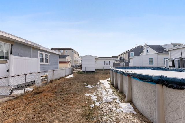 view of yard featuring a covered pool