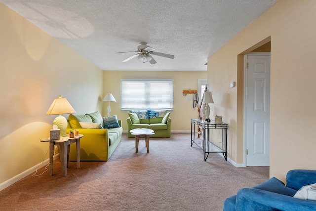 carpeted living room featuring a textured ceiling and ceiling fan