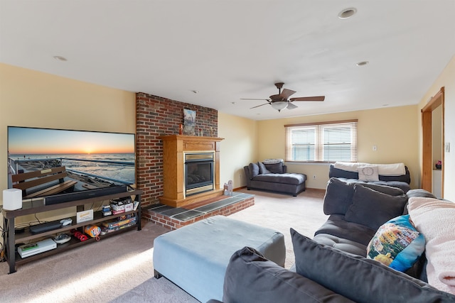 carpeted living room with ceiling fan