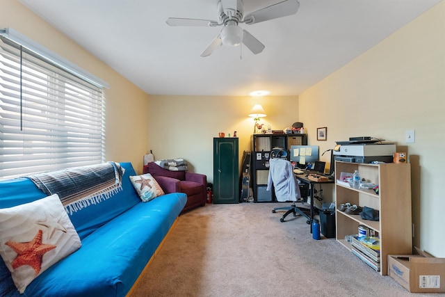 carpeted home office with ceiling fan