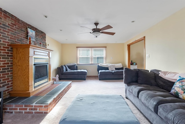 carpeted living room with ceiling fan