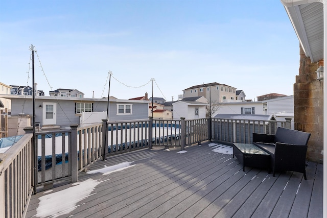 wooden deck featuring a swimming pool