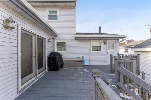 wooden deck with a grill