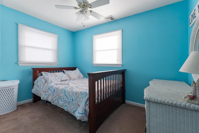 bedroom with ceiling fan and carpet flooring