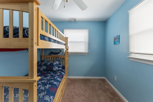 bedroom with ceiling fan and carpet