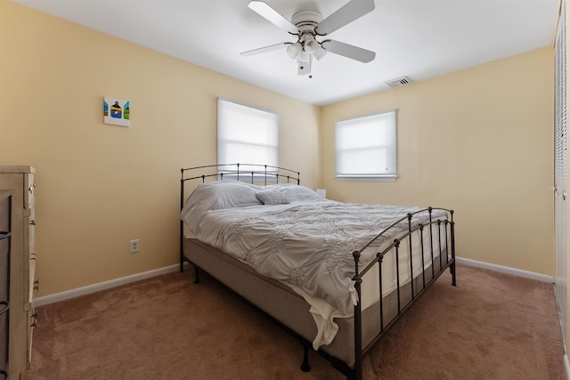 bedroom with dark carpet and ceiling fan