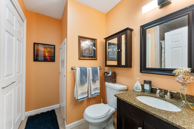 25 N 12th St, Del Haven, NJ 08251 - bathroom with toilet, vanity, a shower with shower curtain, baseboards, and tile patterned flooring