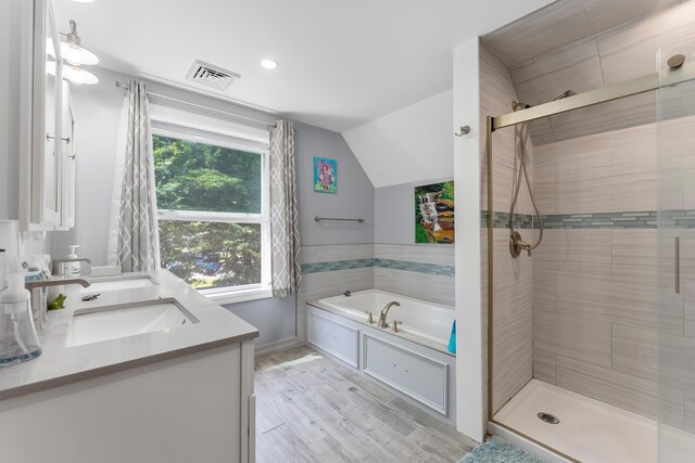 25 N 12th St, Del Haven, NJ 08251 - bathroom with a bath, a stall shower, vanity, lofted ceiling, and wood finished floors