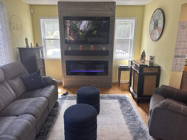 25 N 12th St, Del Haven, NJ 08251 - living room featuring wood finished floors, a large fireplace, and baseboards
