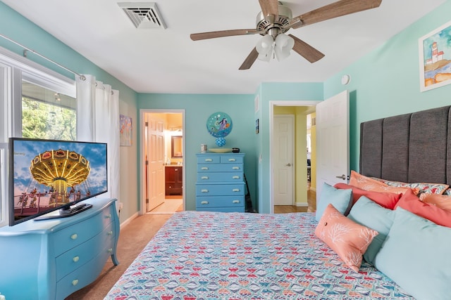 25 N 12th St, Del Haven, NJ 08251 - bedroom with baseboards, connected bathroom, ceiling fan, and light colored carpet