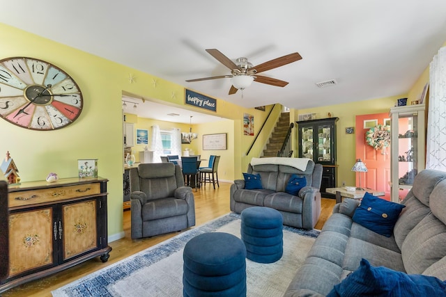 25 N 12th St, Del Haven, NJ 08251 - living room featuring stairs, wood finished floors, ceiling fan, and baseboards