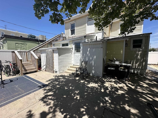 rear view of house with a patio