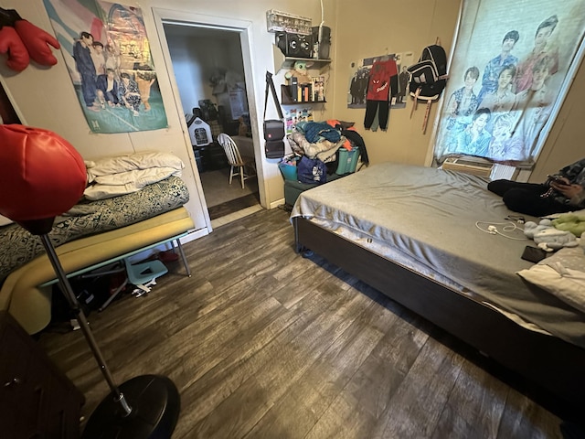 bedroom with wood-type flooring