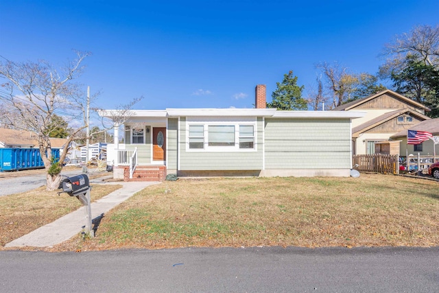 ranch-style house with a front lawn