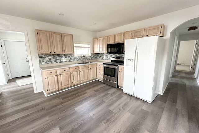 kitchen with sink, white fridge with ice dispenser, stainless steel electric stove, and light brown cabinetry