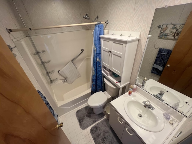 full bathroom with wallpapered walls, shower / tub combo with curtain, vanity, toilet, and tile patterned flooring