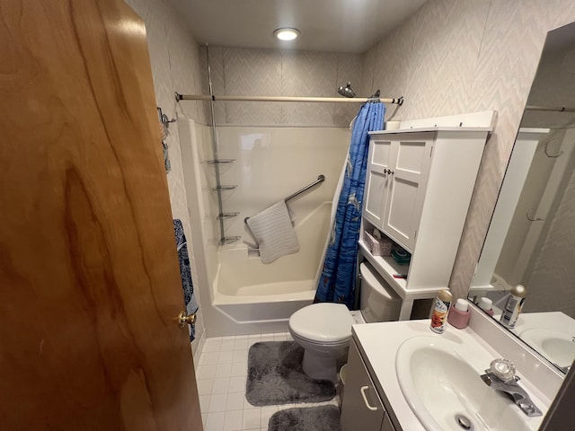 full bathroom with tile patterned floors, shower / bath combo with shower curtain, toilet, and vanity